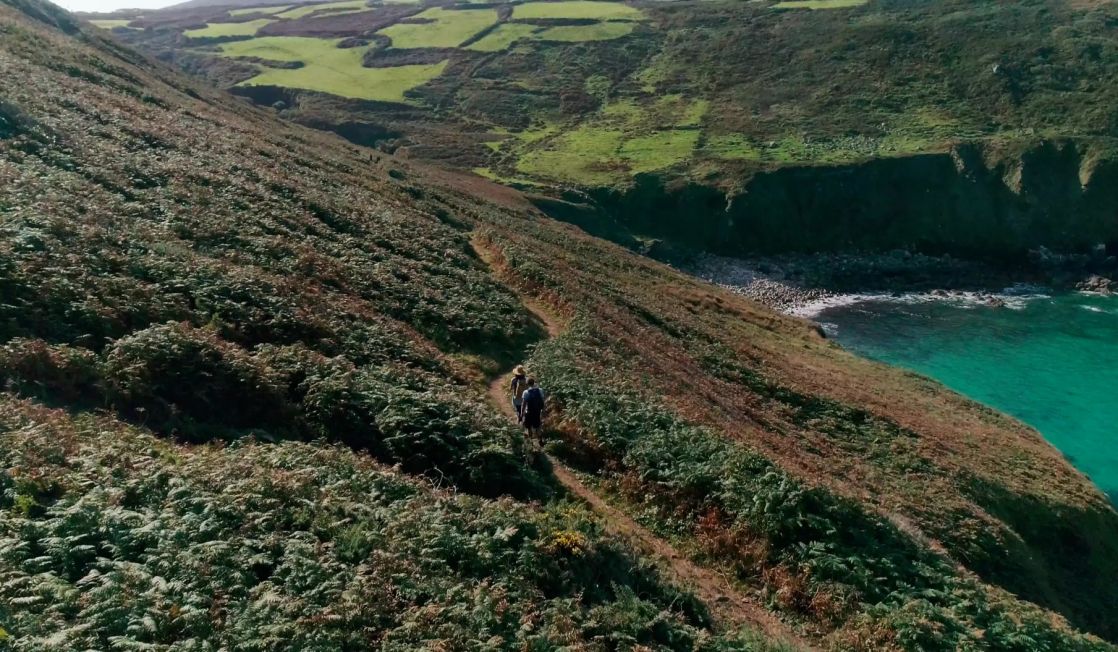 Walkers on the coast path in Cornwall