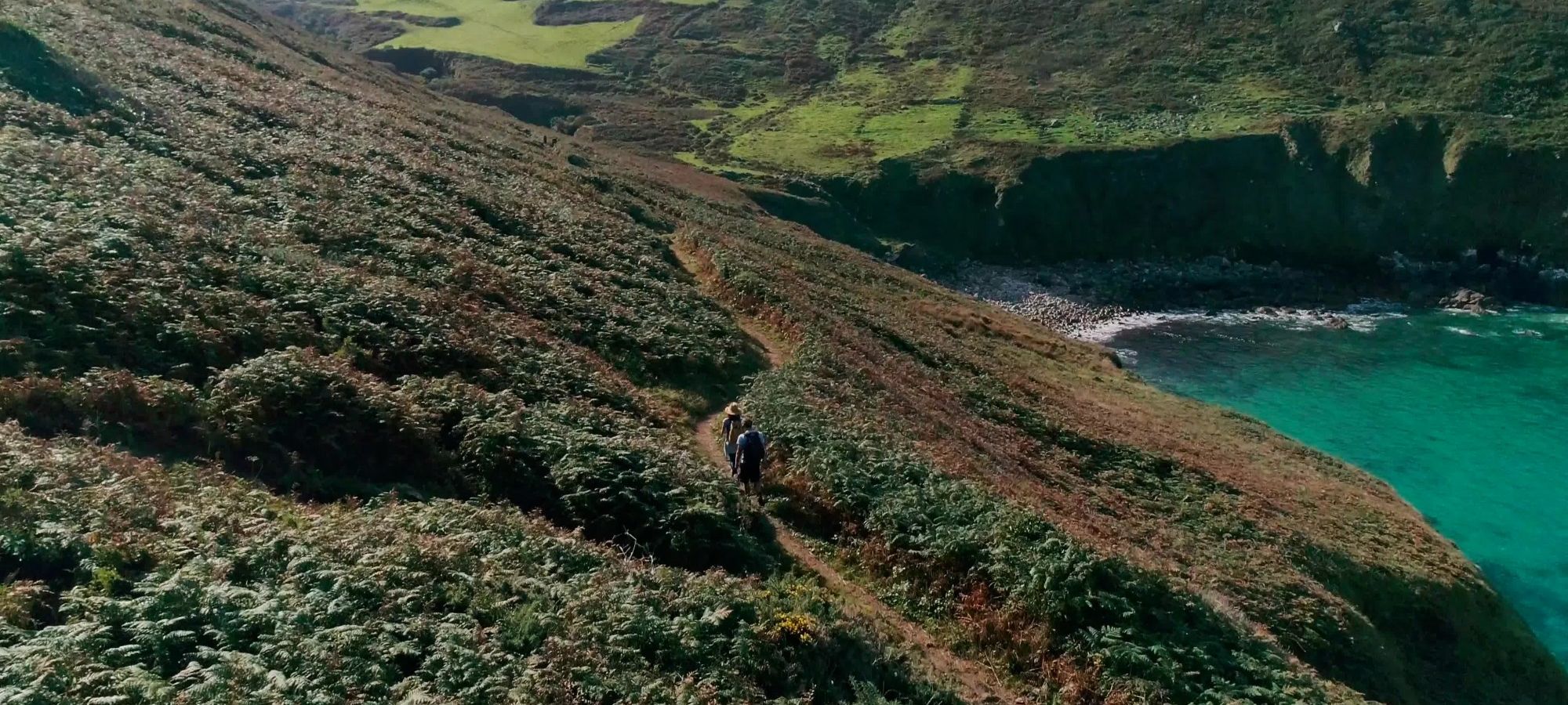 Walkers on the coast path in Cornwall