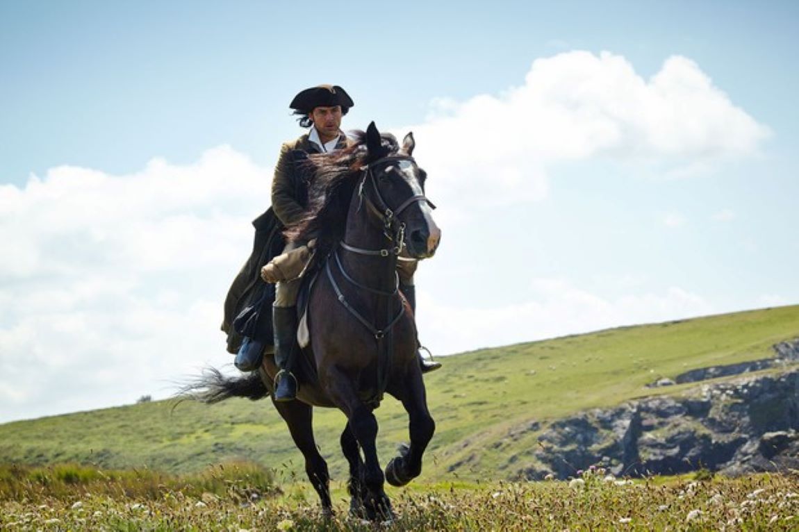 Ross Poldark galloping across the cliffs