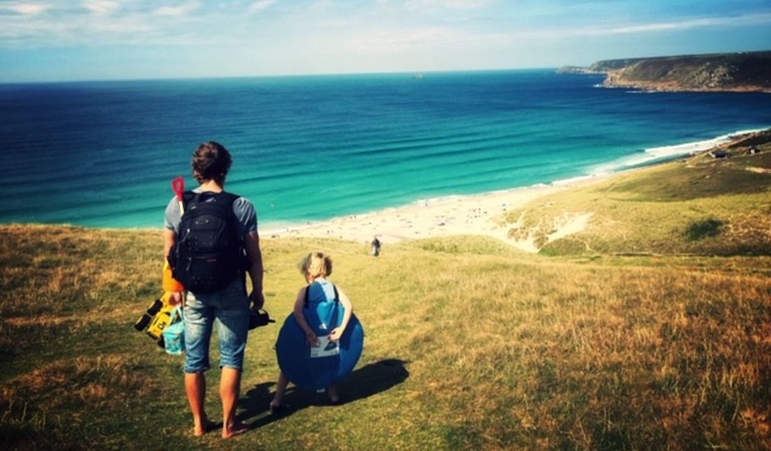 Family on cliffs at Sennen, Cornwall
