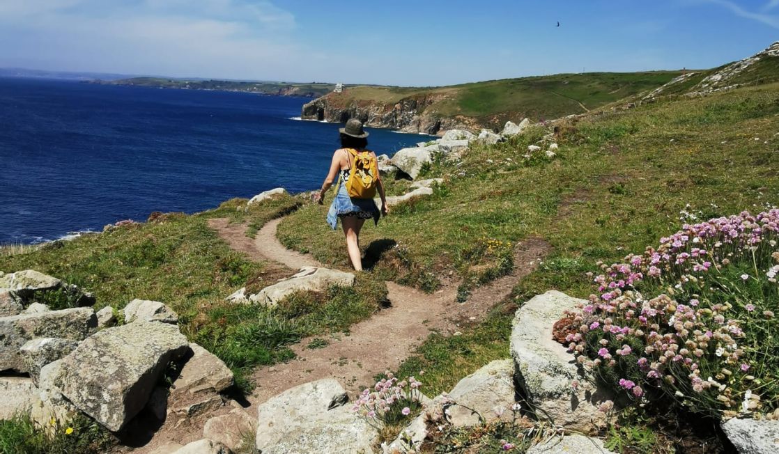 Female walker on the Cornish coast path